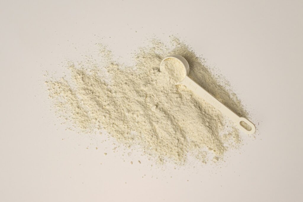 A scoop of collagen powder on a clean background — getting your daily dosage right