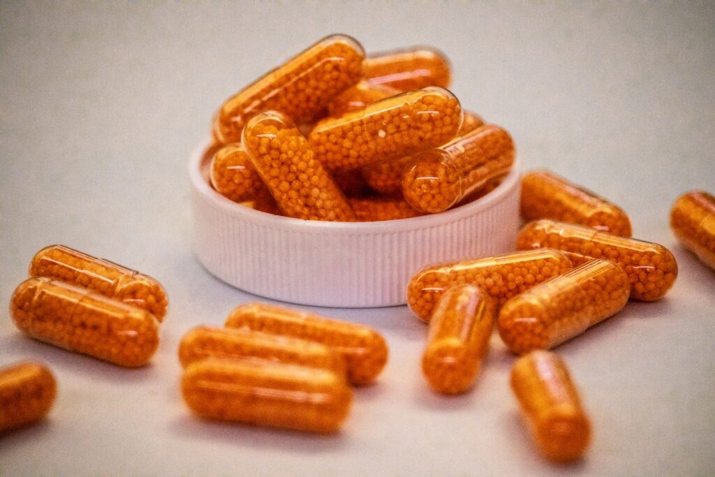 Close-up of supplement capsules, representing perimenopause vitamins and supplements